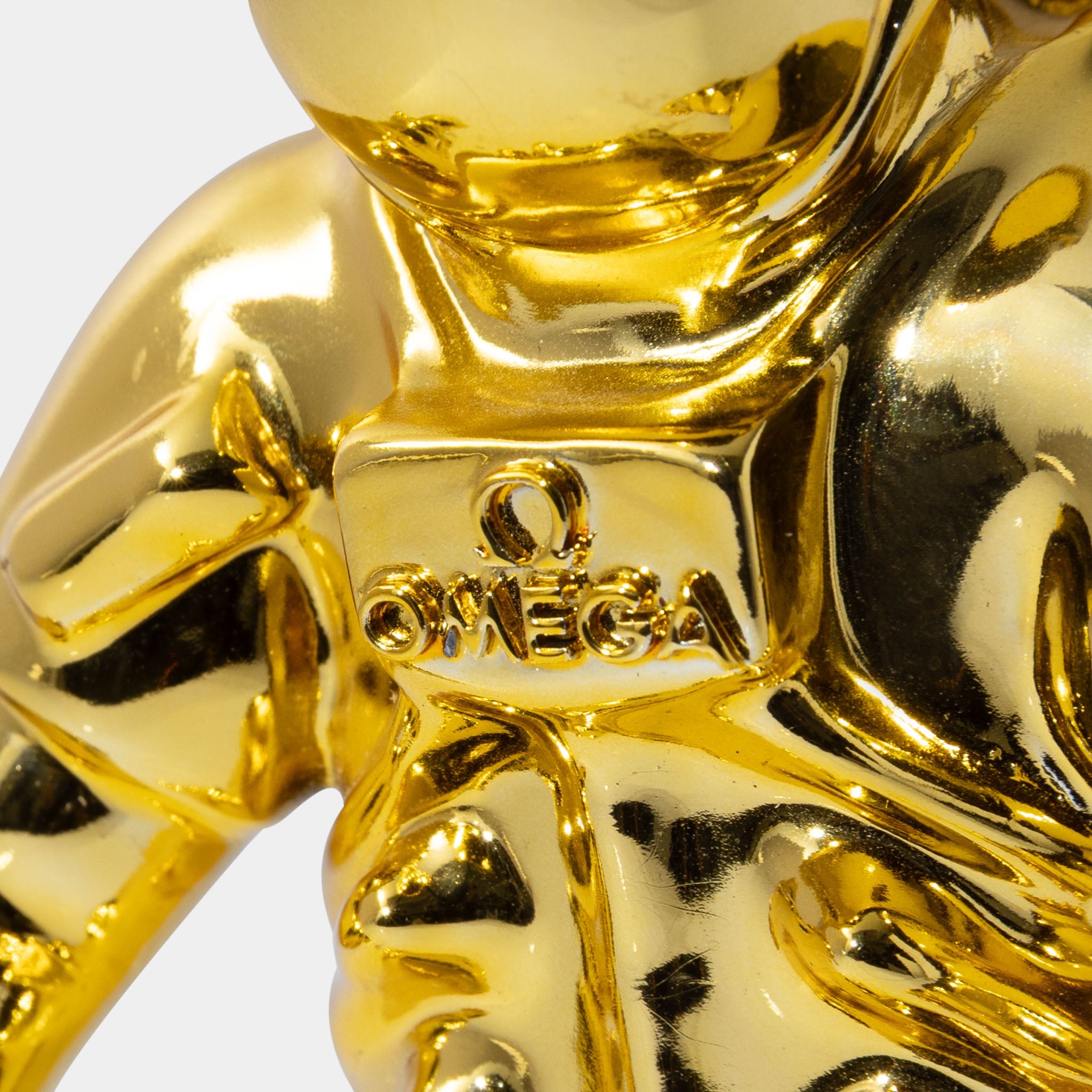 Omega Astronaut collectable figurine gold colour