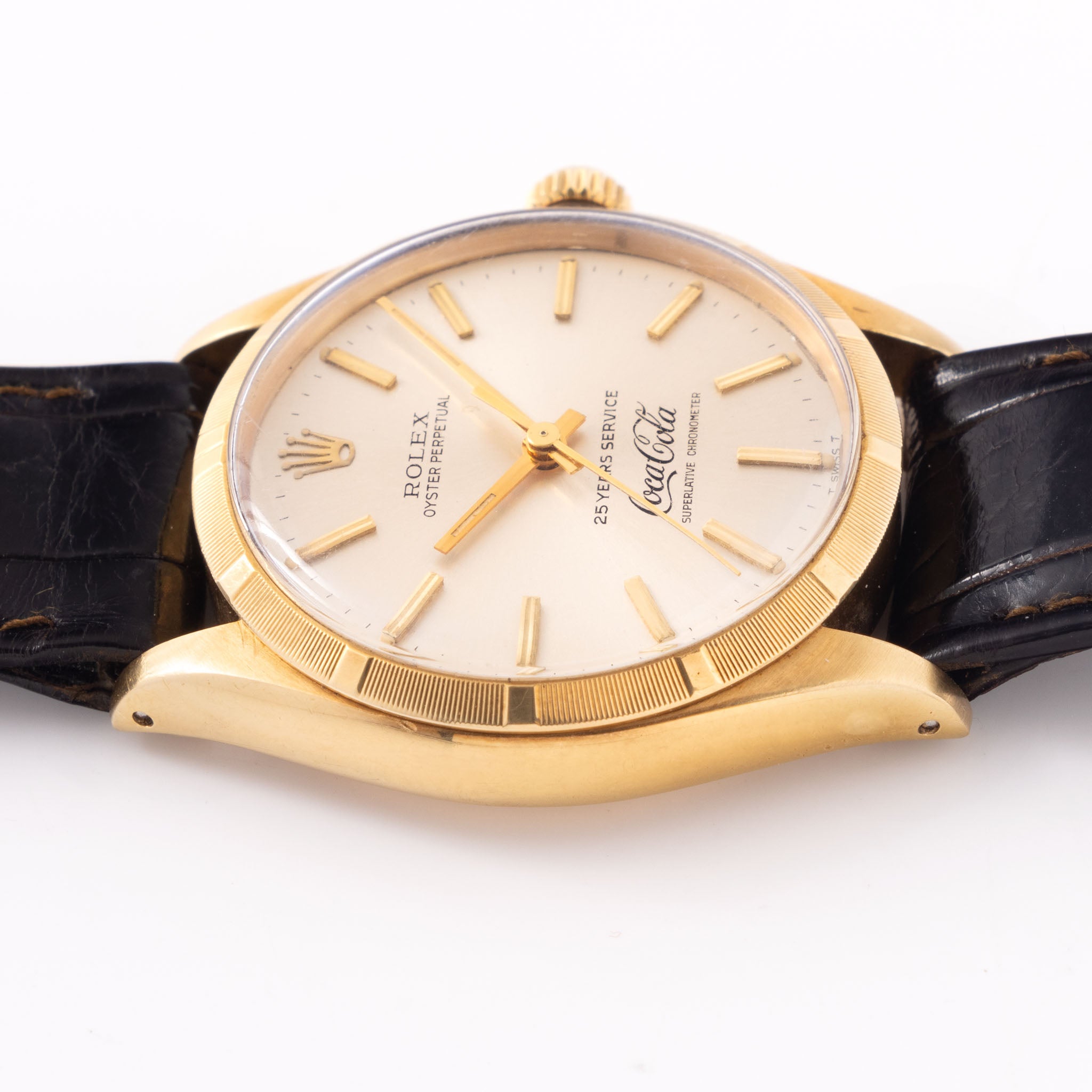 Rolex Oyster -Perpetual silver "25 years Coca Cola service " logo dial in 18 k yellow gold with original double punched papers ref 1003
