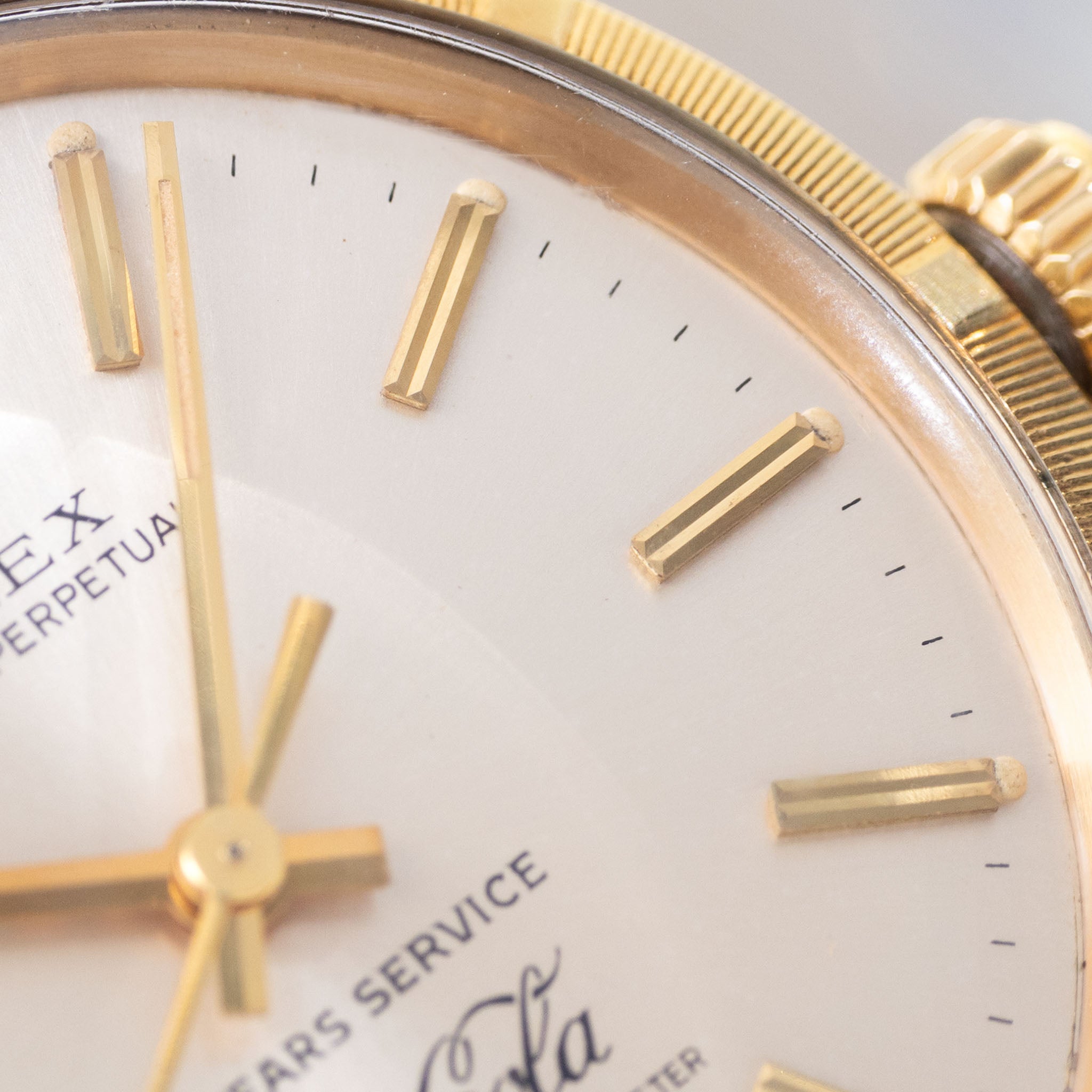 Rolex Oyster -Perpetual silver "25 years Coca Cola service " logo dial in 18 k yellow gold with original double punched papers ref 1003