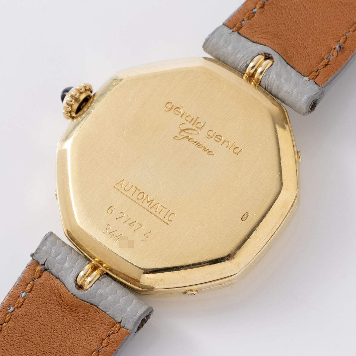 Gerald Genta “Succes “ Day date calendar moonphase with cream dial in 18 k yellow gold ref G2747