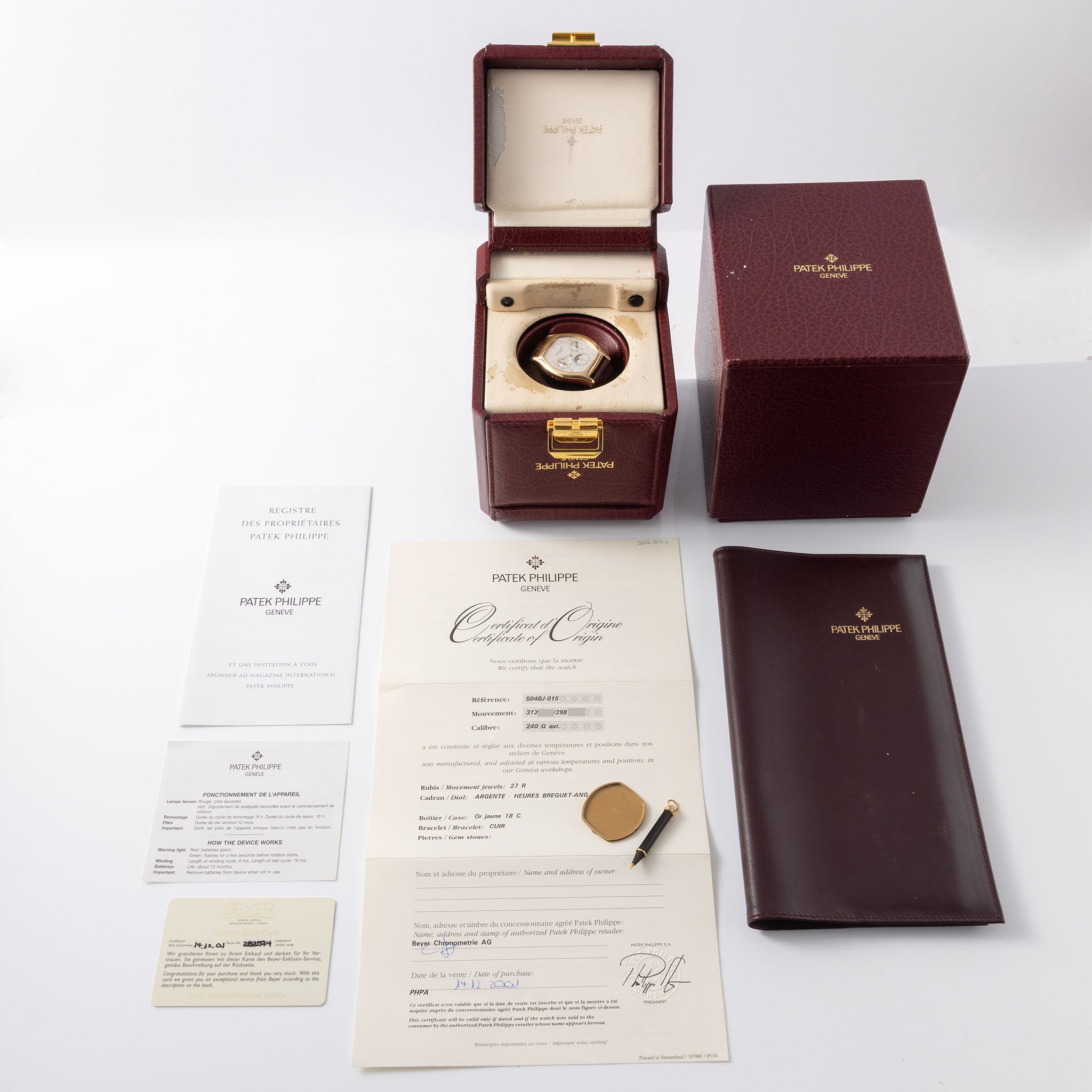 Patek Philippe Perpetual Calendar 5040J in 18k yellow gold Tonneau case with box and papers