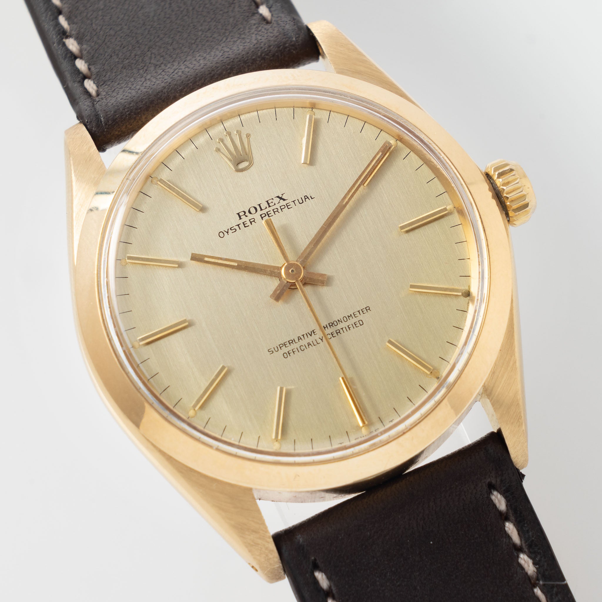 Rolex Oyster Perpetual 1002 Vertical Brush Champagne Dial in 18k Yellow Gold