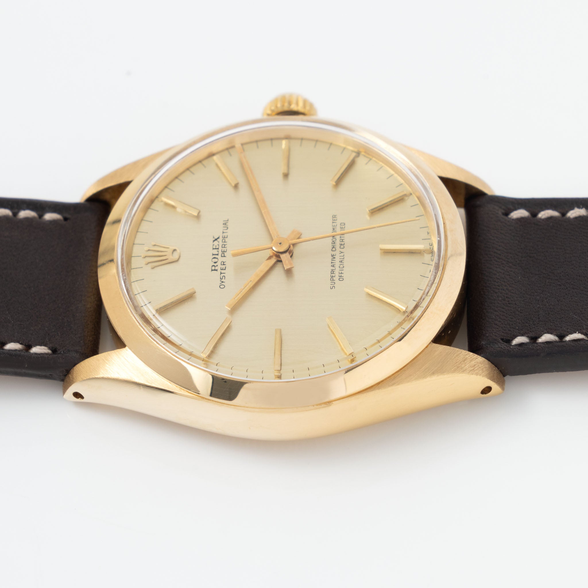 Rolex Oyster Perpetual 1002 Vertical Brush Champagne Dial in 18k Yellow Gold