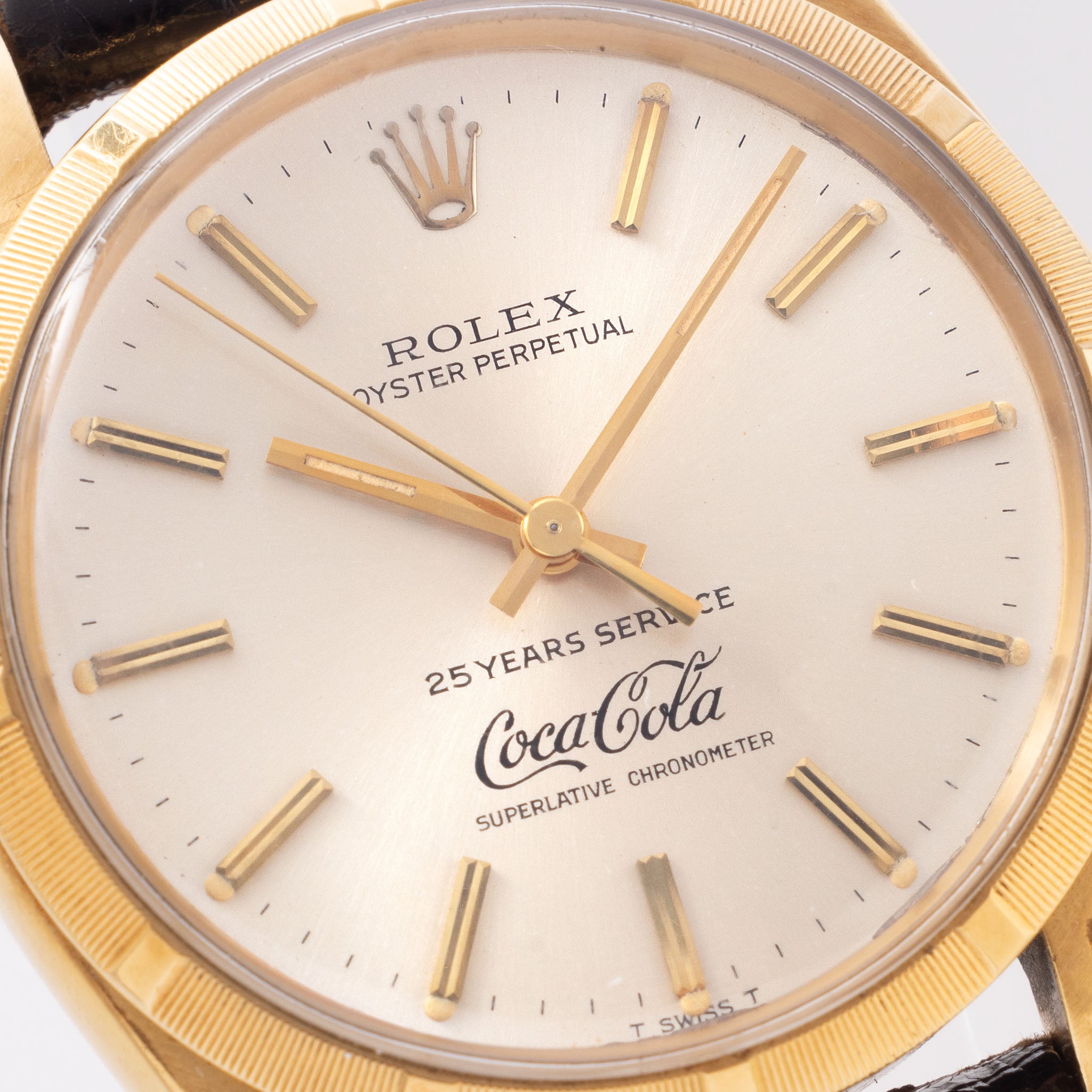 Rolex Oyster -Perpetual silver "25 years Coca Cola service " logo dial in 18 k yellow gold with original double punched papers ref 1003