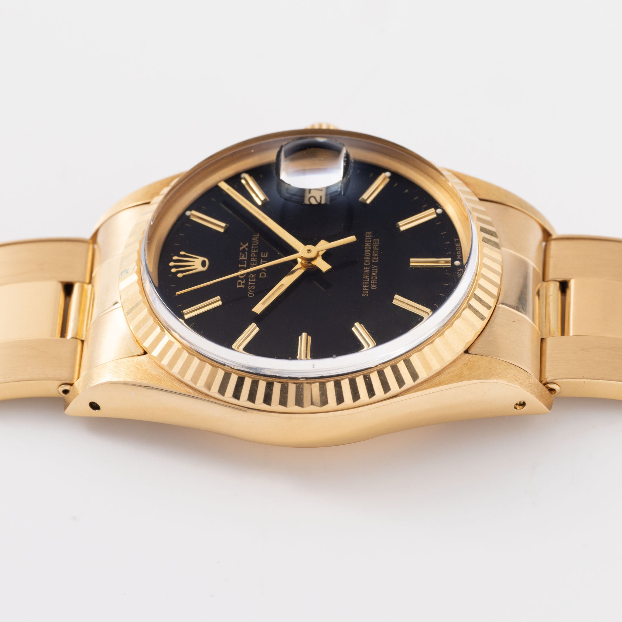 Rolex Oyster-perpetual date black dial in 18 k yellow gold ref 15038
