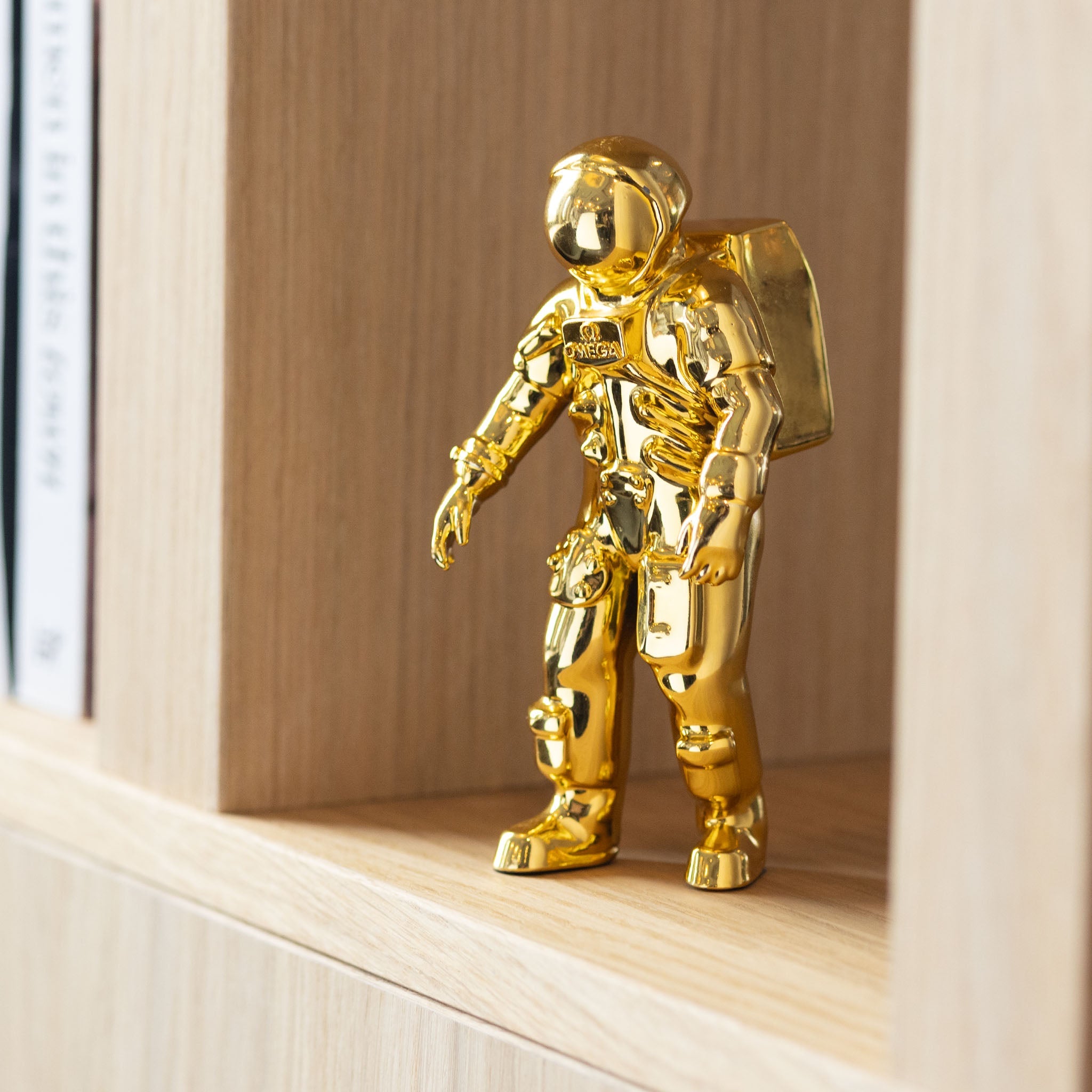 Omega Astronaut collectable figurine gold colour